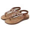 Brown bohemian flip-flop sandals with intricate beaded flower design and rhinestone accents - EU 36 / Camel