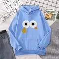 Light blue oversized hoodie with cartoon eyes print and front pocket on a flat lay set - S / Sky Blue