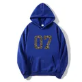 Detail of blue hoodie showing the leopard print 07 graphic and kangaroo pocket - S / Dark Blue