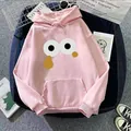 Detail of pink hoodie with cartoon eye graphic and kangaroo pocket in casual setting - S / Dark Pink