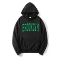 Detail of green Brooklyn print on black hoodie with kangaroo pocket and ribbed cuffs - S / Black