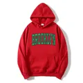 Red oversized hoodie for women featuring a distressed green Brooklyn print and a pocket - S / Red