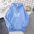 Detailed view of light blue hoodie featuring white bow and moon art print design - Sky Blue