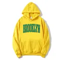 Bright yellow Brooklyn printed hoodie with front pocket and ribbed cuffs on white background - Yellow