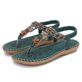 Bohemian teal flat sandals for women featuring colorful beads and metal butterfly decor - EU 36 / Dark Green