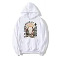 White oversized hoodie featuring vintage Wild West graphic print and desert sunset artwork - S / White