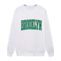 White crewneck long sleeve sweatshirt featuring vintage green Brooklyn lettering - White
