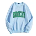 Detail of light blue sweatshirt featuring green vintage Brooklyn print and ribbed collar - Sky Blue
