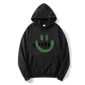 Détail d'un sweat à capuche noir avec smiley vert et impression du texte SMILE - S / Noir