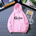 Detailed view of pink oversized hoodie featuring gothic letter print and kangaroo pocket - S / Hot Pink
