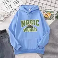 Close-up of light blue hoodie with Magic World graphic print and front pocket details - Sky Blue