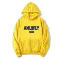 Detailed view of yellow hoodie featuring navy AMLBFLY print and classic kangaroo pocket - Yellow