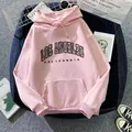 Flat lay of pink Los Angeles hoodie with drawstring and soft fleece texture detail - Dark Pink