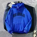 Detail of royal blue hoodie showing kangaroo pocket, drawstring hood and Los Angeles print - Dark Blue