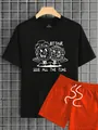 Detailed view of the 100% polyester fabric and printed cartoon alarm clock on the black tee - S / Black T-Shirt Orange Shorts