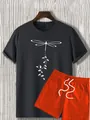 Close-up of summer printed t-shirt with orange shorts showing the size M neck label - S / Gray T-Shirt Orange Shorts