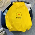Detail of yellow fleece hoodie with sunflower and Be Kind print on soft fabric - S / Yellow