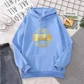Flat lay of an oversized light blue hoodie with gold circular graphic print and drawstring - S / Sky Blue