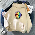 Detailed macro shot of beige hoodie featuring a rainbow smile face and L size label - S / Apricot