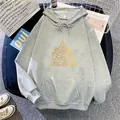 Detailed view of grey oversize hoodie featuring a golden Eye of Horus print and front pocket - S / Light Gray