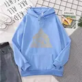 Detailed flat lay of light blue hoodie with yellow triangle eye print and casual props - S / Sky Blue