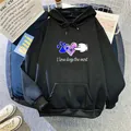 Detail of black hoodie featuring colorful graffiti dog print and kangaroo pocket design - S / Black