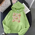 Macro detail of green hoodie featuring cute pumpkin prints and a large kangaroo pocket - S / Grass Green