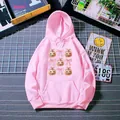 Close-up of pink hoodie featuring a Halloween pumpkin and bow print with front pocket - S / Hot Pink