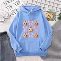 Light blue hoodie with pumpkin and bow print featuring a front pocket and drawstring - S / Sky Blue