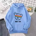 Detail of light blue hoodie featuring rainbow bear graphic and cozy kangaroo pocket - S / Sky Blue
