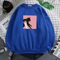 Detail of blue crewneck sweatshirt featuring a black cat art print and ribbed cuffs - S / Royal Blue