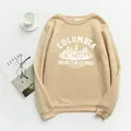 Dettaglio flat lay di felpa beige con stampa Colombia retrò e polsini a coste elasticizzati - S / Albicocca
