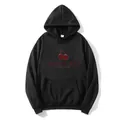 Women's black oversized hoodie with red cherry graphic and Monties typography - S / Black