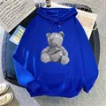 Detail of blue fleece hoodie featuring geometric bear print and front kangaroo pocket - S / Royal Blue