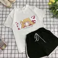 Set sportivo estivo da donna con maglietta grafica bianca e pantaloncini neri casual - M / Bianco