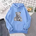 Light blue fleece hoodie for women featuring a grey geometric bear print and kangaroo pocket - M / Sky Blue
