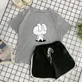 Flat lay of gray rabbit print T-shirt and black shorts with white contrast binding - Gray