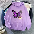 Detail of oversized purple hoodie featuring butterfly and flower print with kangaroo pocket - Light Purple