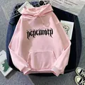 Detail of pink oversized hoodie showing gothic lettering, drawstring hood and kangaroo pocket - Dark Pink