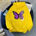 Flat lay of bright yellow hoodie with artistic floral butterfly print and front pocket - S / Yellow