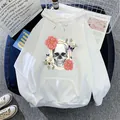 Detail of white hoodie with skull and floral print on denim background with props - S / White