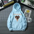 Flat lay of light blue hoodie with kangaroo pocket and orange heart graphic detail - S / Sky Blue