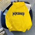 Vibrant yellow oversized hoodie featuring gothic art print and classic kangaroo pocket - Yellow