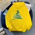 Flat lay of a yellow Christmas hoodie with a green tree print and kangaroo pocket - S / Yellow