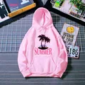 Detail of pink hoodie featuring palm tree sunset graphics and soft knitted fabric texture - Hot Pink