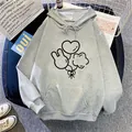 Detailed view of light grey hoodie with cartoon balloon print on cozy fabric - S / Light Gray
