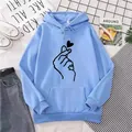 Detail of light blue hoodie featuring finger heart print and large kangaroo pocket - Sky Blue