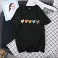 Detail of black cotton t-shirt featuring colorful heart prints and one day at a time text - S / Black