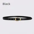 Slim black leather belt for women featuring a gold horseshoe buckle on grey background - 105cm / Black