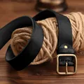 Men's retro black leather belt with a solid brass pin buckle on a vintage wood table - 105cm / Black